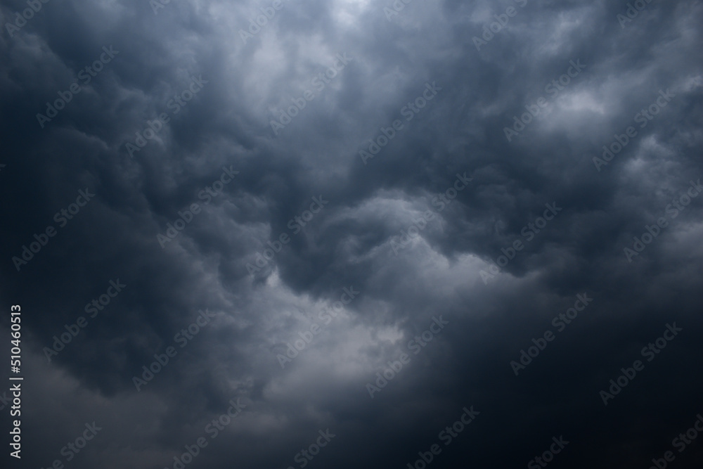 Fototapeta premium Dark rainy twisted thunderstorm clouds grey color horizontal image