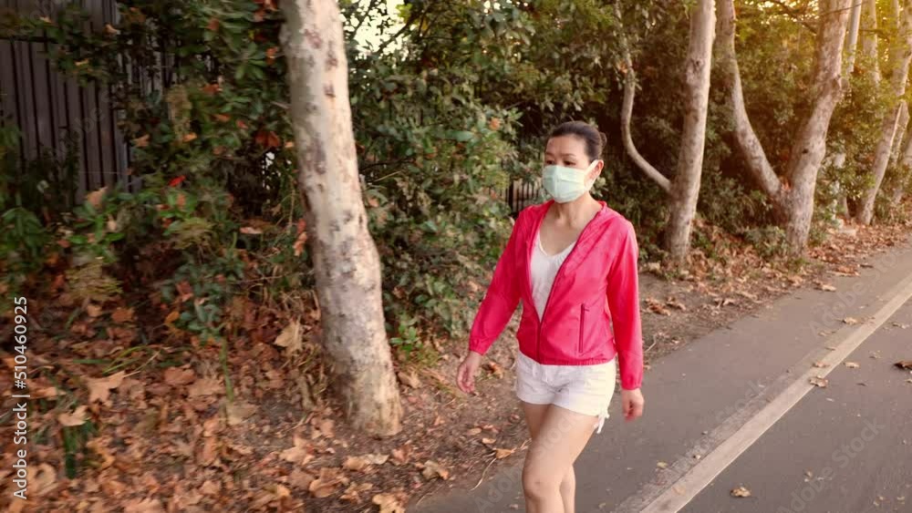 Asian woman going for a hike while wearing a face mask. Los Angeles California. Asian woman going for a hike while wearing a face mask. Los Angeles California.