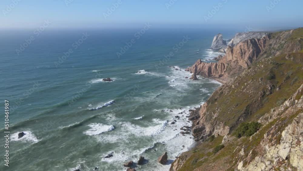 Scenic view of the Atlantic Ocean and rocky shores at Cape Roca in Portugal. The Cabo da Roca lighthouse at the top of Cape Roca. Municipality of Sintra, Lisbon district, Portugal. 4K video Scenic view of the Atlantic Ocean and rocky shores at Cape Roca in Portugal. The Cabo da Roca lighthouse at the top of Cape Roca. Municipality of Sintra, Lisbon district, Portugal. 4K video