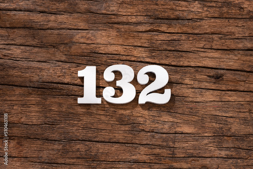 Number 132 - piece on rustic wood background