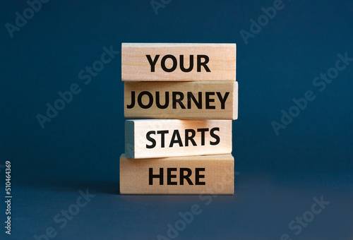 Your journey starts here symbol. Concept words Your journey starts here on wooden blocks on a beautiful grey table grey background. Business  motivational and your journey starts here concept.