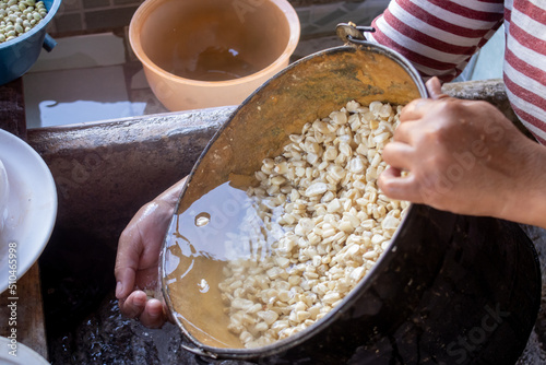 preparacion de nixtamal de maiz, para la elaboracion de tortillas torteadas en cocinas tradicionales mexicanas, en san gregorio, mixtlan, jalisco photo