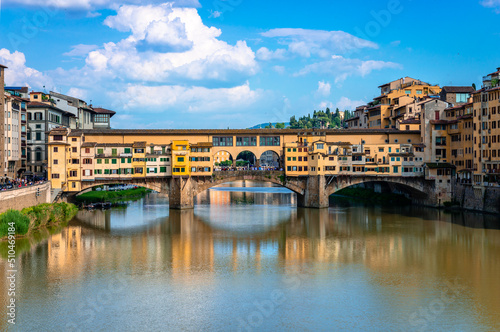 Ponte Vecchio (old Bridge) in Florence, Tuscany, Italy. This medieval stone bridge that spans river Arno, consists of three segmental arches and it has always hosted shops and merchants.