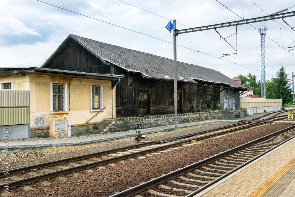 Old wooden station building next to the tracks