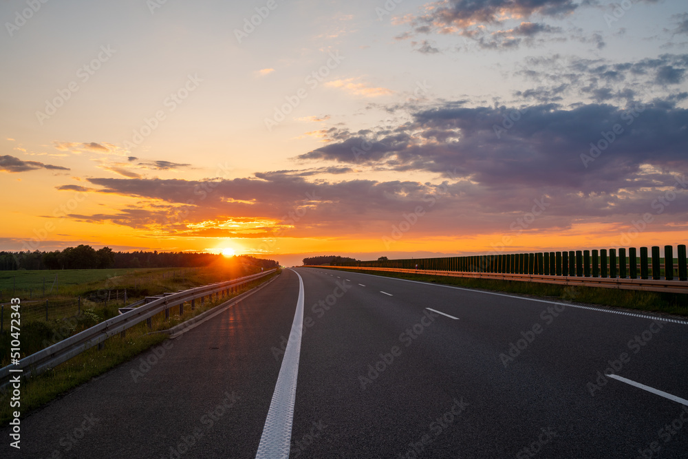 empty highway during a spectacular sunset