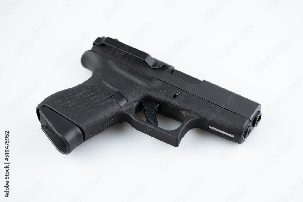 Modern self loading pistol isolated on white background. Semi automatic gun with belt clip Modern self loading pistol isolated on white background. Semi automatic gun with belt clip