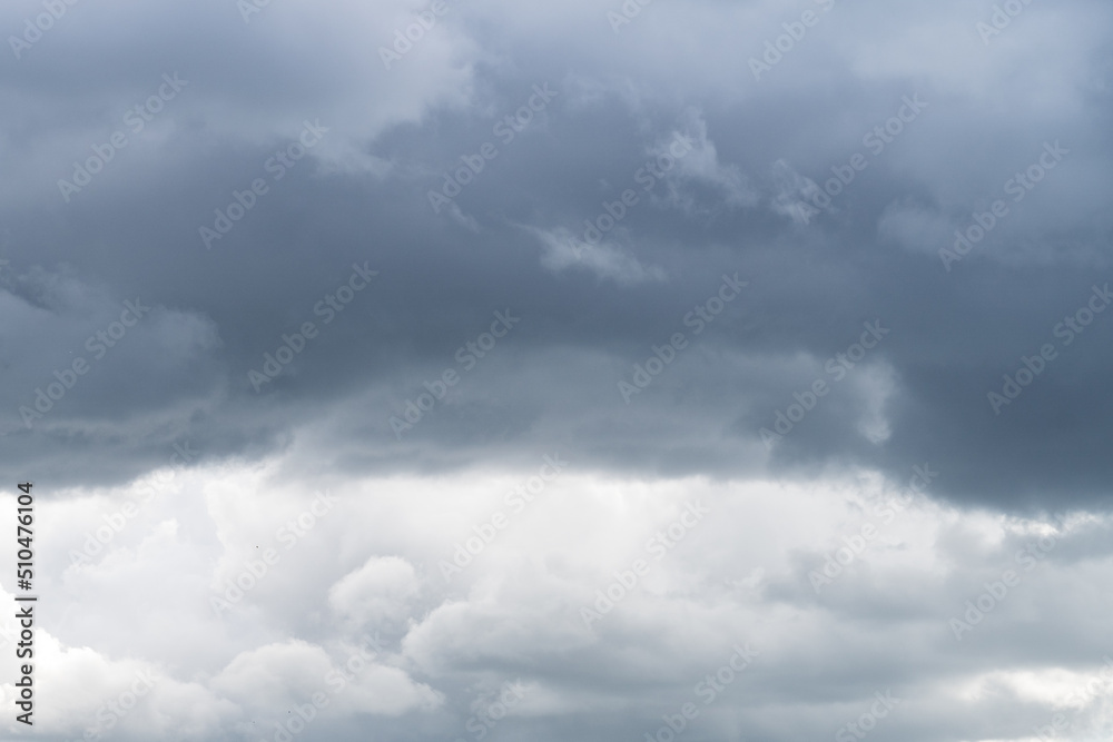 Sky with stormy gray cumulus clouds during rainy gloomy weather as background. Sky with stormy gray cumulus clouds during rainy gloomy weather as background.