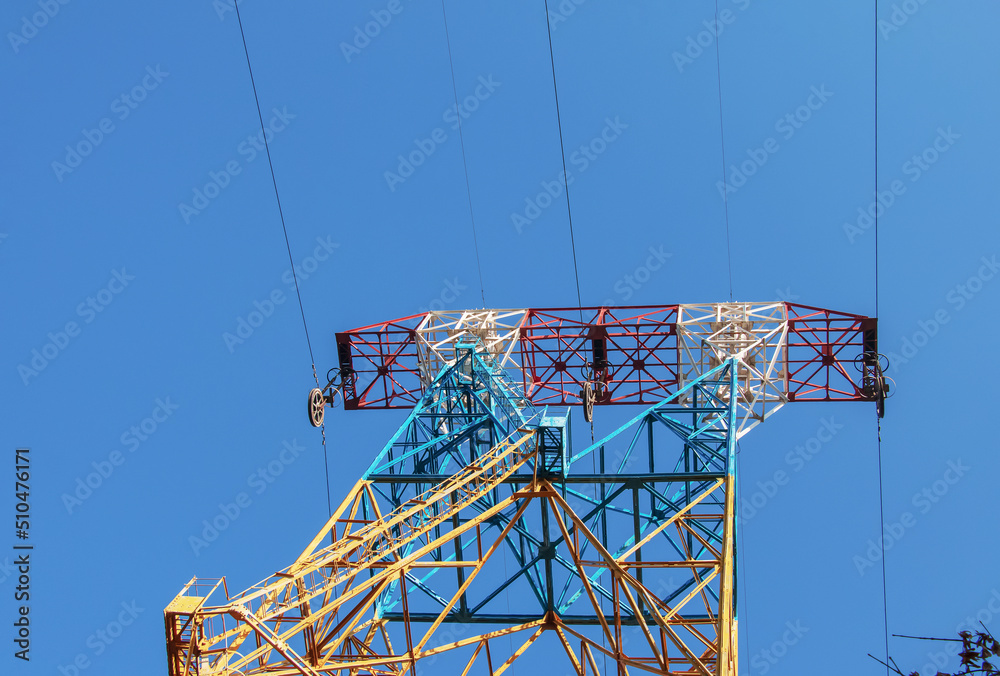 High voltage electric power lines on pylons in blue sky. Stock Photo ...