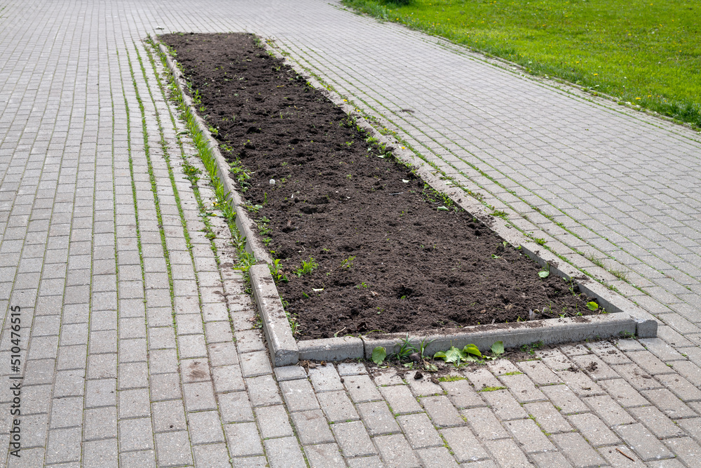 Land on city flower bed prepared for planting flowers in Moscow, Russia Land on city flower bed prepared for planting flowers in Moscow, Russia