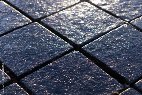 wet street footwalk tiles photo