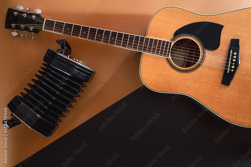 Fototapeta premium Flat lay, music background with acoustic guitar.