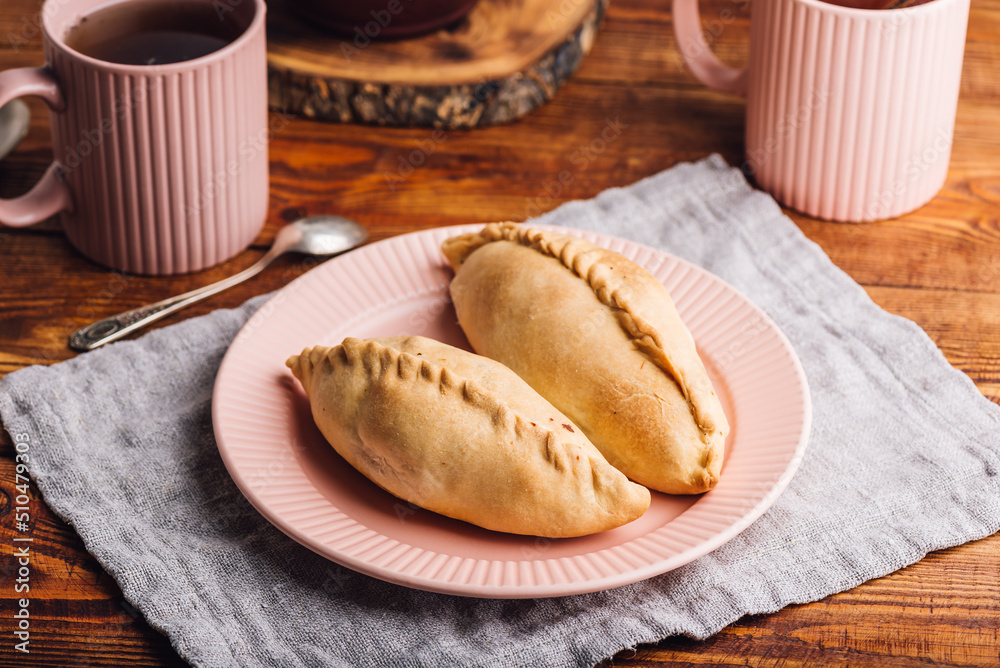 Naklejka premium Two Cabbage Pies on Plate