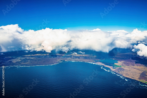 Beautiful view of cloudscape covering landscape. Aerial view of scenic dramatic land by Atlantic ocean. Scenery of idyllic natural environment in northern Alpine region.