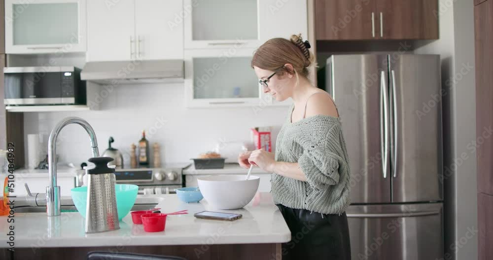 Young Woman Baking Cooking Preparing Cake Food in Kitchen Young Woman Baking Cooking Preparing Cake Food in Kitchen