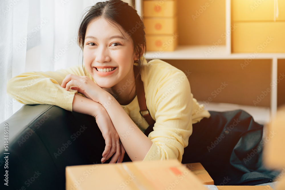 Partnership of SME entrepreneur teamwork of small business work at home family online marketing with packing box prepare for deliverty to customers at warehouse home seller office Partnership of SME entrepreneur teamwork of small business work at home family online marketing with packing box prepare for deliverty to customers at warehouse home seller office