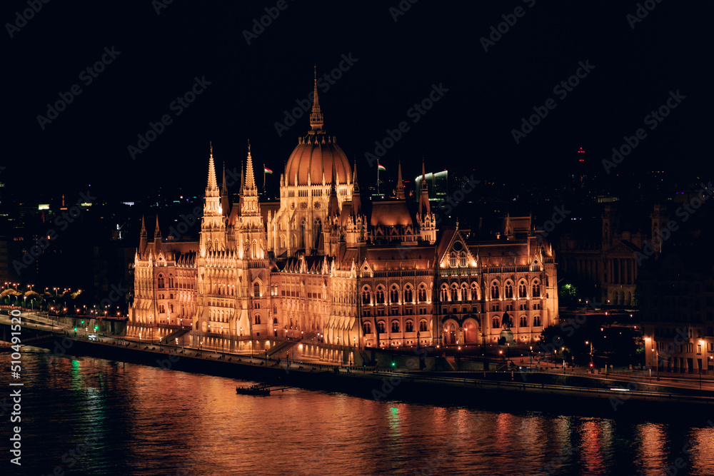 Hungarian Parliament and Danube river at night, Budapest, Hungary.