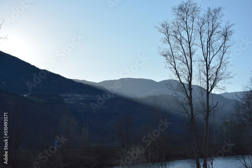 Mountains, trees and the river Etsch, in Vilpian, south Tirol