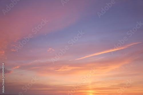 Fototapeta Naklejka Na Ścianę i Meble -  Clear blue sky. glowing pink and golden cirrus and cumulus clouds after storm, soft sunlight. Dramatic sunset cloudscape. Meteorology, heaven, peace, graphic resources, picturesque panoramic scenery