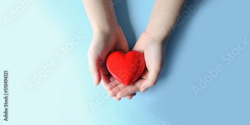 Woman hand holding red heart, World health day, Health care and mental health concept, Health insurance, Charity volunteer donation, CSR responsibility, World heart day