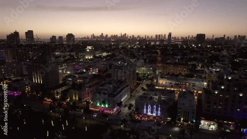 Wallpaper Mural Aerial Panning Scenic Shot Of Illuminated Modern City Against Sky At Dusk - Miami, Florida Torontodigital.ca