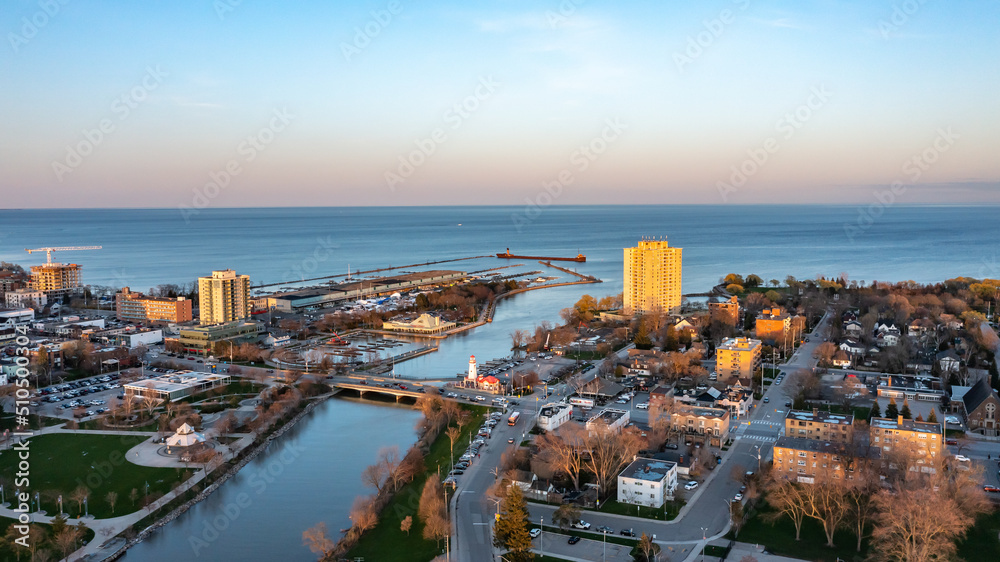 Aerial view of Port Credit at the mouth of the Credit River at sunset facing Lake Ontario in the summer.