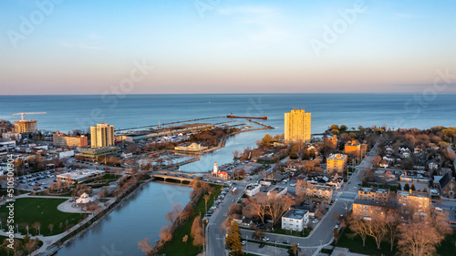 Aerial view of Port Credit at the mouth of the Credit River at sunset facing Lake Ontario in the summer. © Scott