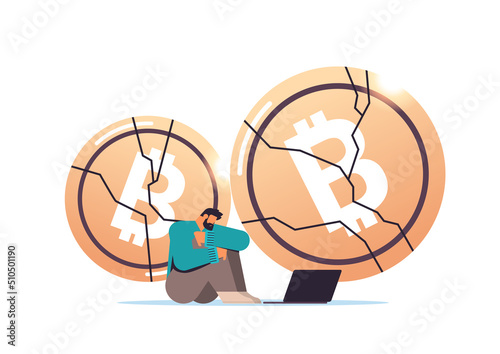 businessman sitting near crashed coin cryptocurrency crash bitcoin price collapse crypto loss investment