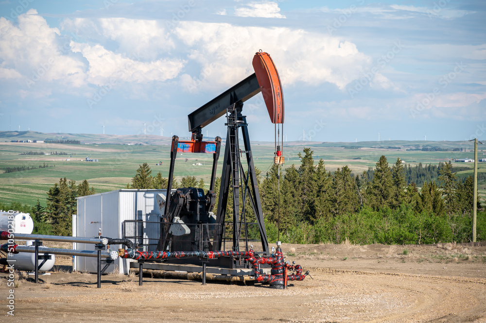 Pumpjacks working in the oil fields of Alberta on a spring day. Pumpjacks working in the oil fields of Alberta on a spring day.