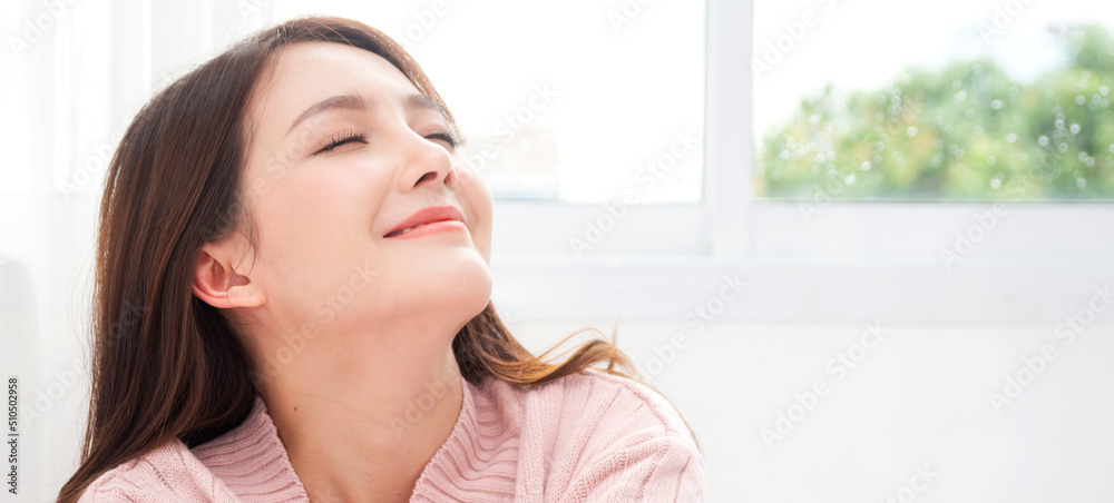 Portrait of smiling cheerful beautiful pretty asian woman clean fresh healthy white skin posing smile in pajamas white clothes.Girl felling relax and enjoy time on the bed at home.asia beauty Portrait of smiling cheerful beautiful pretty asian woman clean fresh healthy white skin posing smile in pajamas white clothes.Girl felling relax and enjoy time on the bed at home.asia beauty
