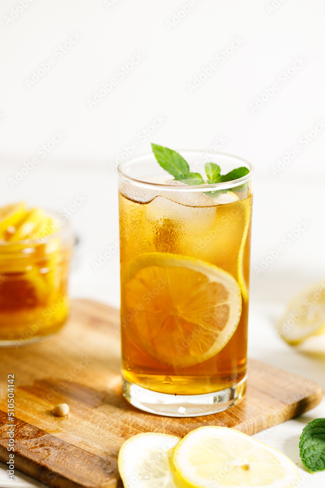 glass of ice lemon tea with mint. glass of ice lemon tea with mint.