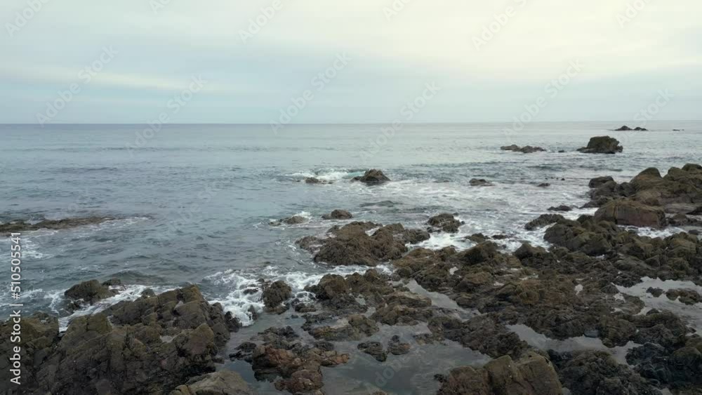 The rocky coastine at Kennack Sands, Cornwall, England gives way to a sandy beach in a popular holiday destination. The rocky coastine at Kennack Sands, Cornwall, England gives way to a sandy beach in a popular holiday destination.