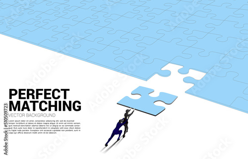 Silhouette of businessman pushing the final jigsaw piece. Concept of perfect recruitment. Human Resource. put the right man on the right job.