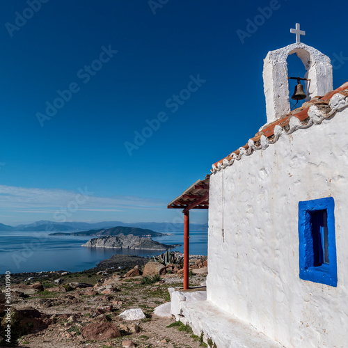 Four Islands: Aegina, Moni, Angistri and Peloponnese. View from Saints Anargyroi chapel on a rocky hilltop, with blue sea and sky in the background.  photo