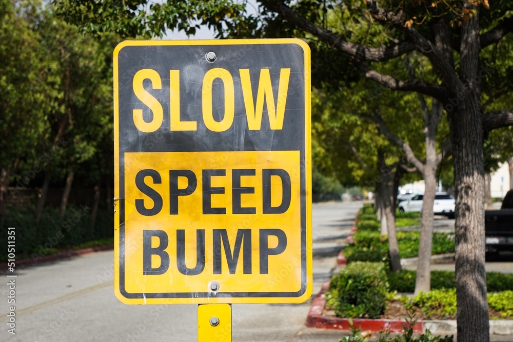 Slow speed bump road sign
