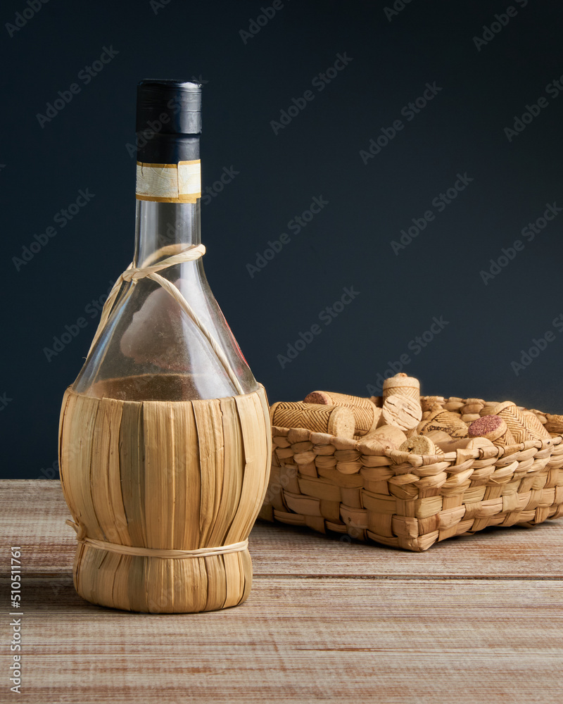 Naklejka premium old craft bottle of wine on wooden surface