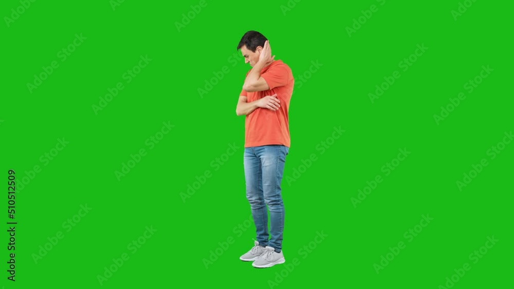 Cautious male looking at camera. Green background Cautious male looking at camera. Green background