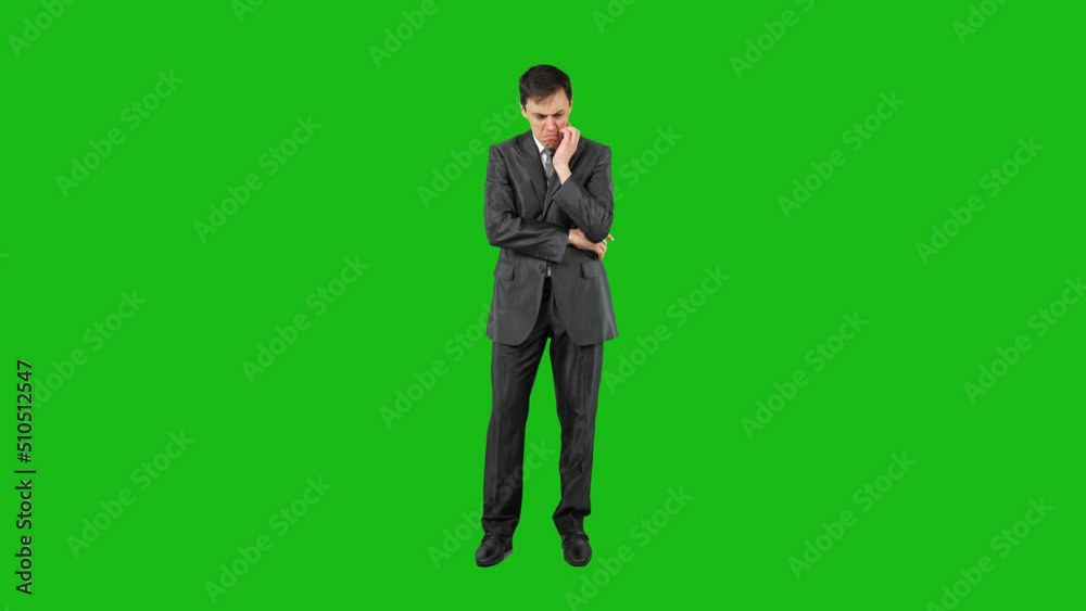 Clueless businessman shrugging shoulders against chroma key