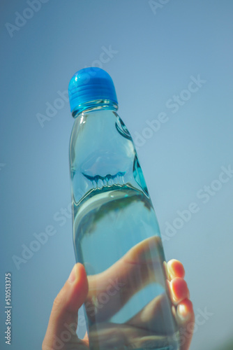 hand holding bottle of water