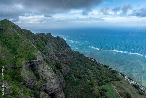 Mountain peaks by the ocean leading to deep valley with clouds above the tops, Oahu Island, Hawaii