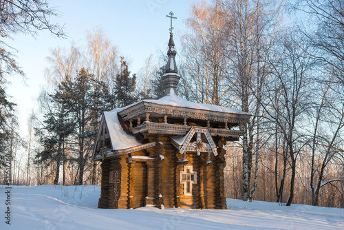 Old wooden chapel of St. Isaac of Dalmatia (1881) on a February day, Vytegra photo