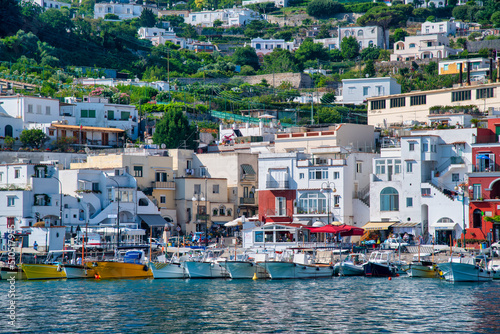 Capri, Italy - June 18, 2021: Tourists and restaurants in the small port of Capri
