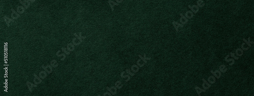 フェルト調の質感のある深緑色の紙の背景テクスチャー