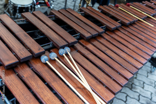 Huge wooden xylophone percussion instrument with drumsticks