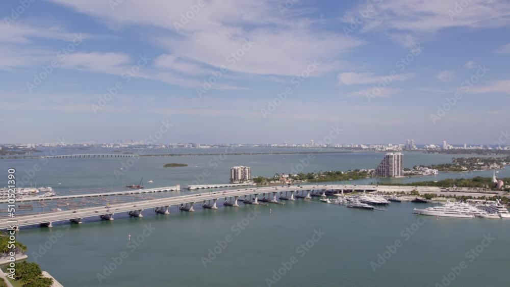 Aerial Beautiful Shot Of Bridge Over Sea In City, Drone Flying Forward On Sunny Day - Miami, Florida Aerial Beautiful Shot Of Bridge Over Sea In City, Drone Flying Forward On Sunny Day - Miami, Florida