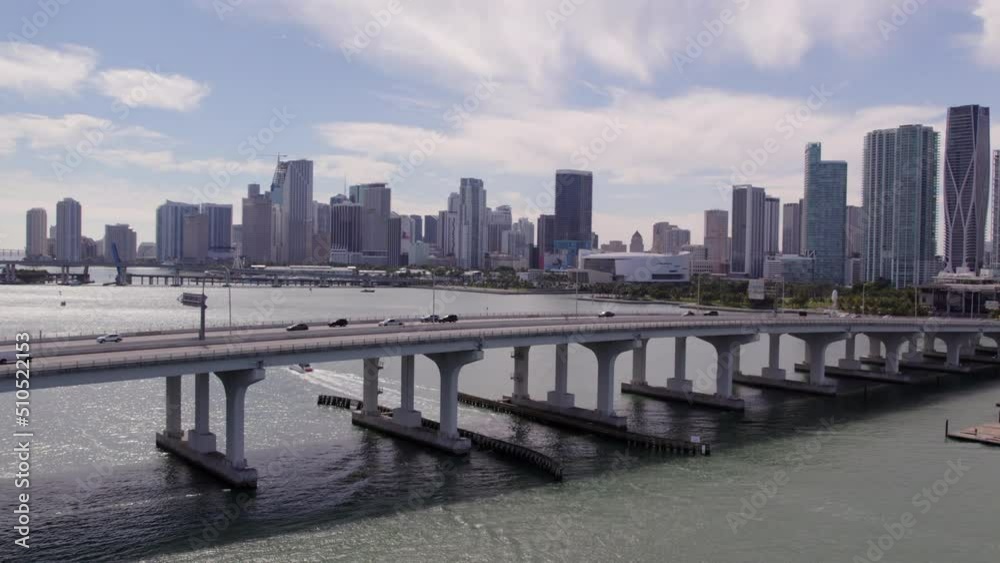 Aerial Forward Shot Of Cars Moving On Bridge Roads Over Sea By Modern City - Miami, Florida Aerial Forward Shot Of Cars Moving On Bridge Roads Over Sea By Modern City - Miami, Florida