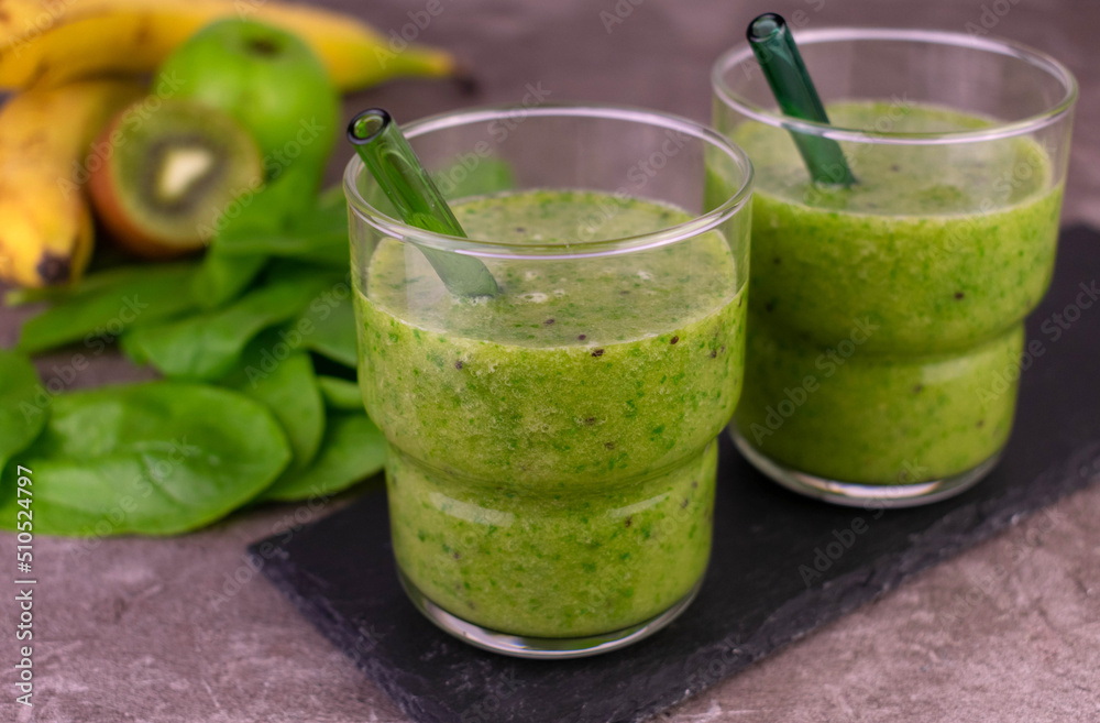 Glass of green healthy smoothie. Raw vegan food.
Glass of green healthy smoothie. Raw vegan food.