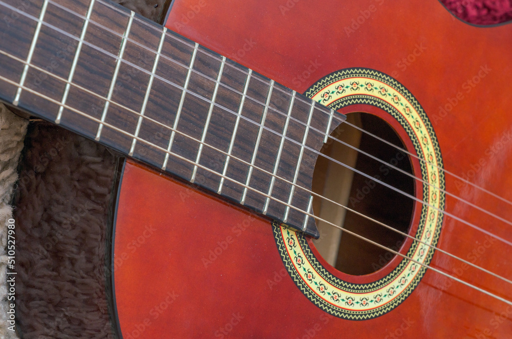 wooden five-string guitar close-up wooden five-string guitar close-up