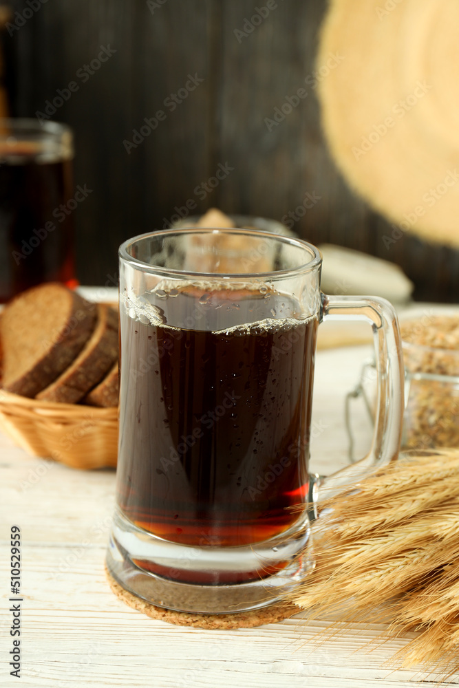 Concept of fresh drink on white wooden table, kvass Concept of fresh drink on white wooden table, kvass
