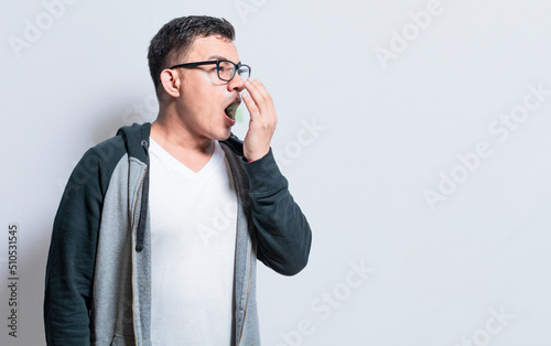 Handsome man with bad breath and halitosis problem, People with bad breath problem, Concept of person with halitosis and bad breath photo