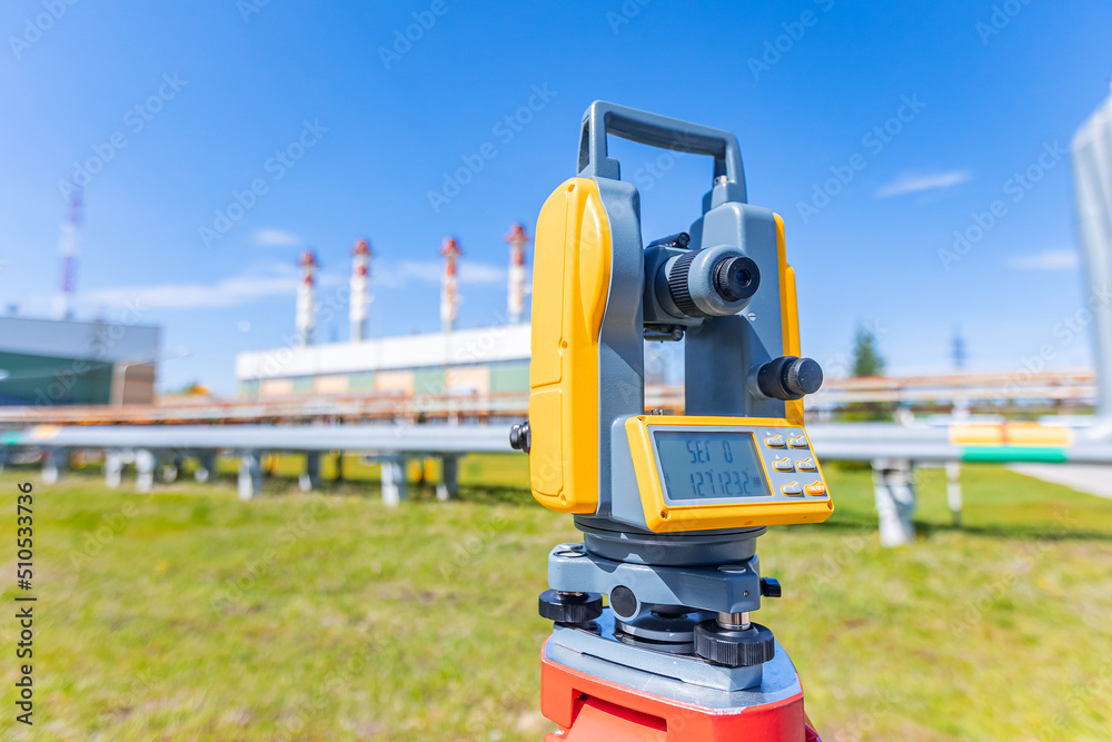 Industry control level and inspection chimneys power plant roof Laser optical theodolite on tripod. Equipment for work surveyor